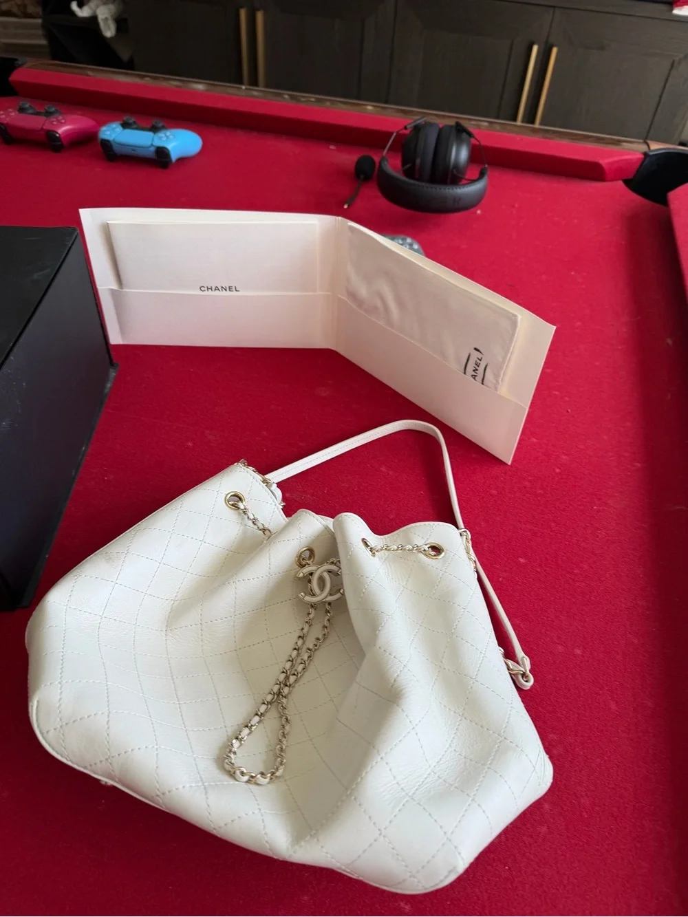 CHANEL Cream Quilted Drawstring Bucket Bag with Gold Chain
